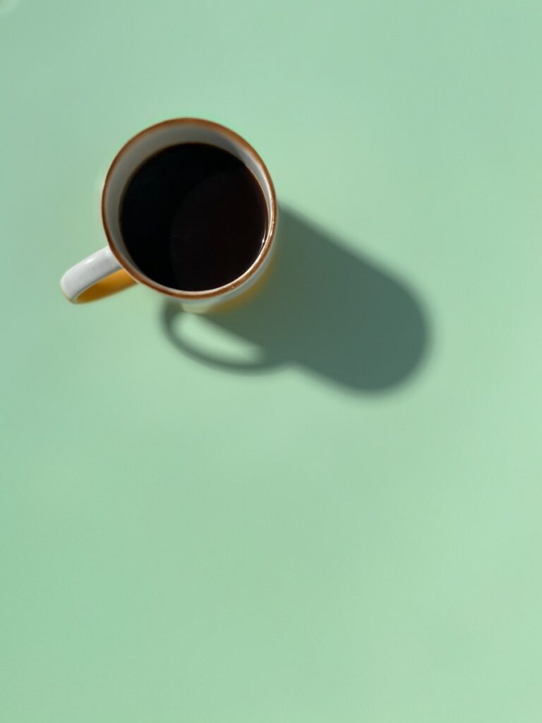 white ceramic mug with black liquid